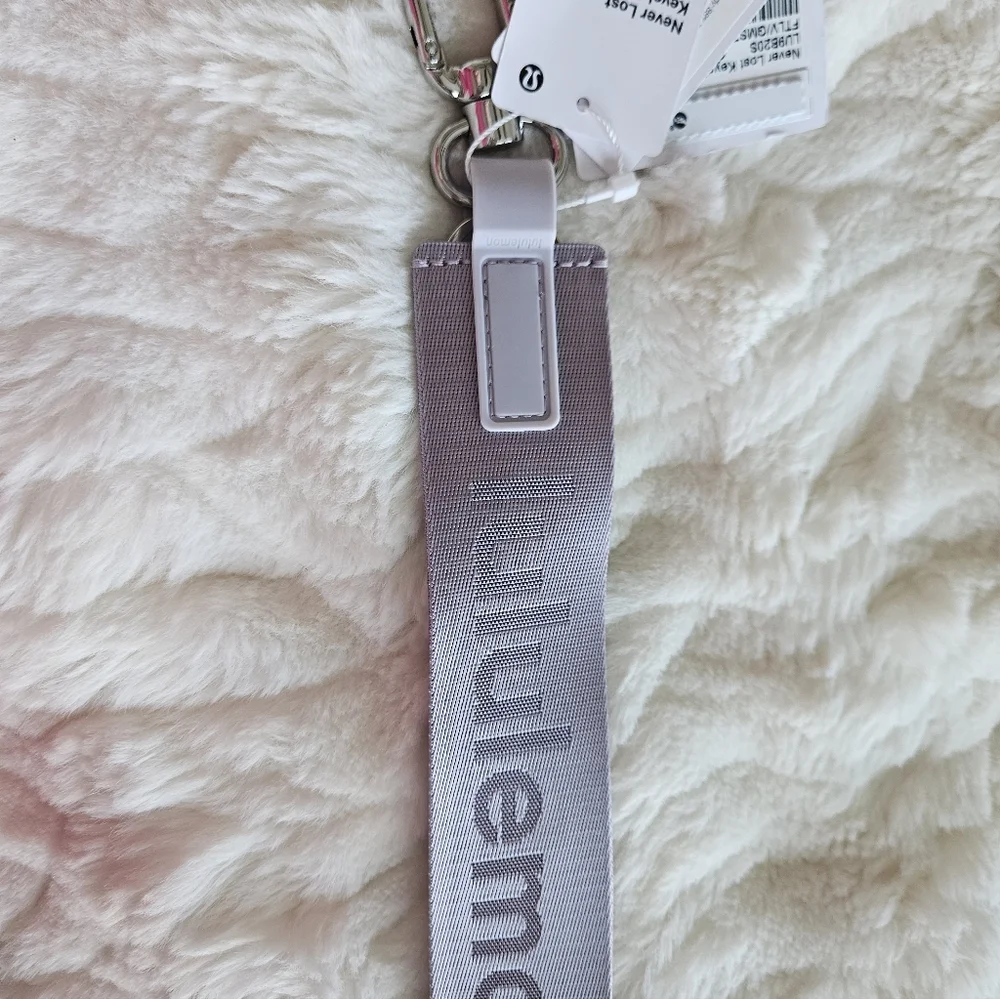 NWT Never Lost Keychain Faint Lavender/Grape Mist